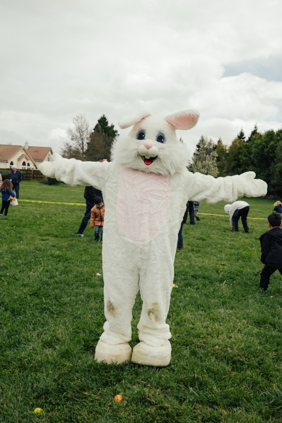 The Easter Bunny welcomes kids onto the field at the club's egg hunt